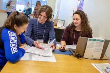 students working on tax preparation