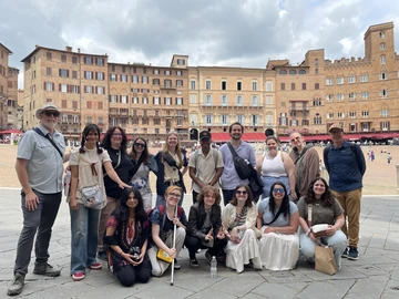 Gathering in front of Piazza del Campo in Siena, Italy, are (front row, from left): Nia Anand, Caitlyn Sterner, Eli Conrad, Paige Smith, Jean Castro and Vanessa Lotito; (back row): Associate Professor Peter Tucker, Maya Kulick, Andrea Conner, Brittany Howe, Kady Osborne, Jaivon Eggleston, Noah Freeland, Sarah Crouse, Olivia Schindler and Professor David Kinkela.