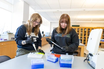 two students working in a lab