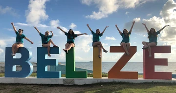 students site on Belize sign, TESOL major, Education major