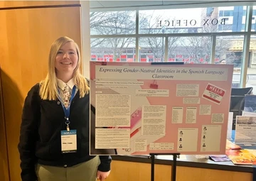 Britt Cranmer with poster at conference