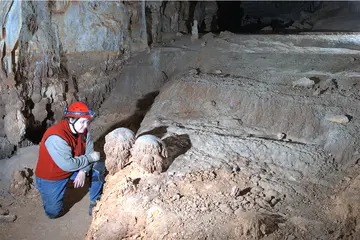 Dr. Leslie Melim in a cave