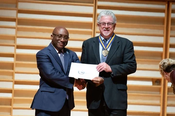 President Stephen H. Kolison Jr. with School of Music Operations Manager Marc Levy.