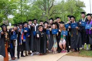 faculty and students following 2022 Commencement