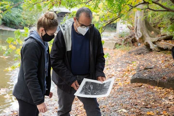 faculty member works with art student outside