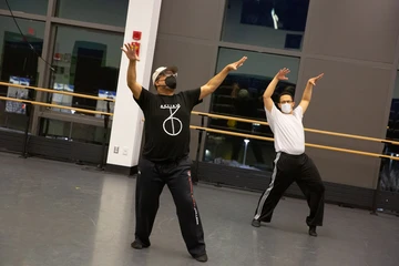 Carlos Jones works with a student
