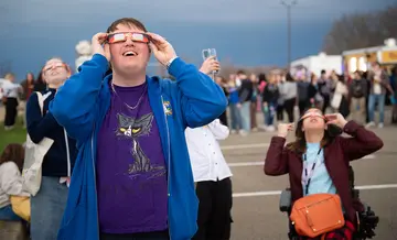 Catching a glimpse of the partial solar eclipse, following nearly four minutes of the full eclipse of the sun.