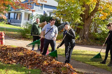 students raking leaves in the community, Public Relations major, Communications major