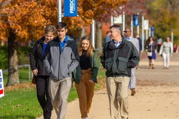 Family Weekend attendees walking on campus