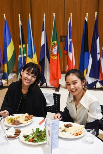 students at international dinner
