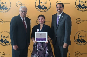 Emma Goetz with Chancellor John King and SUNY Board of Trustees Vice Chair Cesar Perales