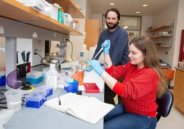 Gabrielle Cruz, with her research adviser, Dr. Jonathan Kniss, in a Science Center laboratory.