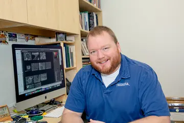 Dr. Thomas Hegan at computer