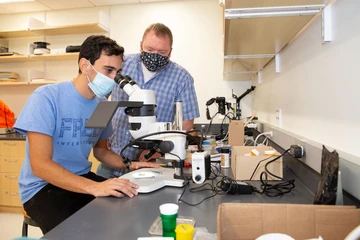paleontologists working in a lab on campus