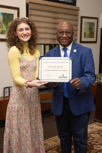 Alyssa Bump with President Stephen Kolison, Communication major, Journalism major, Public Relations major