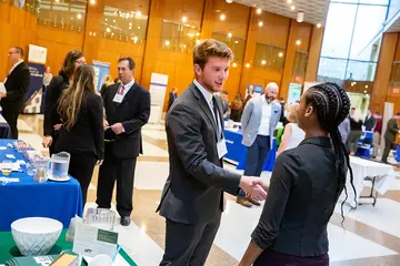 Students connect with potential employers at a past Meet the Professionals Night, an annual event hosted by the School of Business and held in the Williams Center.