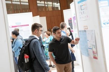 students present at in-person research conference
