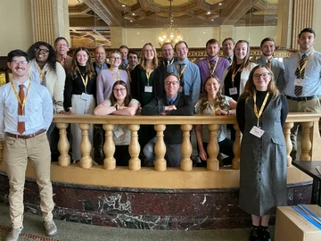 group photo of students, faculty at conference