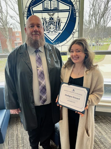 Madigan Howard displays her award with Jacob Steinhoff, a residence director.