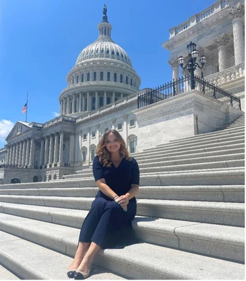 Rachel Skeirik sitting on capitol steps, Political Science program, Communication Studies program