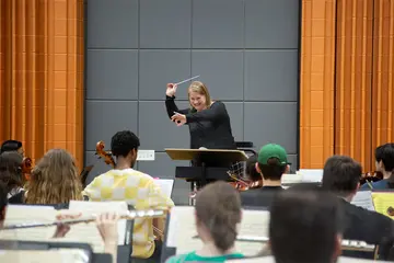 Dr. Emily Schaad rehearses the College Symphony