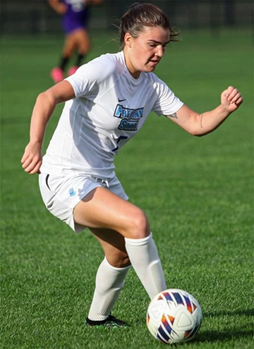 Katie Sellers playing soccer