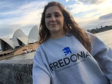 student in front of Sydney Opera House