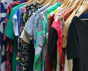 images of clothing on hanging rack