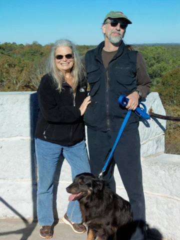 Diane Clark and Bill Moran, who operate Greystone Nature Preserve, with their dog