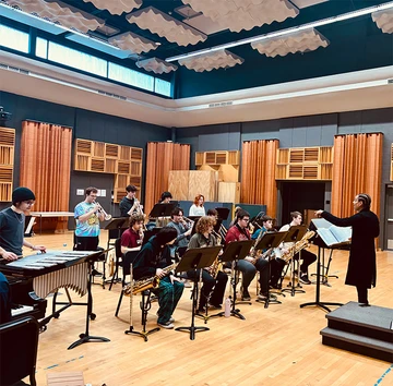 Dr. Leon Dorsey conducts the jazz orchestra in rehearsal