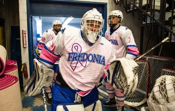 ice hockey players in Pink the Rink special jerseys, men's ice hockey