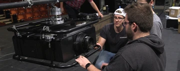 College of Visual and Performing Arts students set up one of the new projectors in Marvel Theatre.