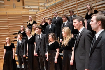 students singing on stage