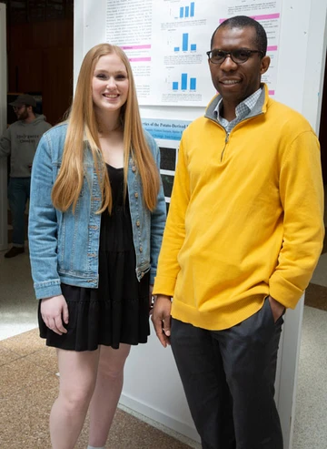 Caitlyn Snyder, with Dr. Emeka Okeke, at the OSCAR Expo in the Williams Center.