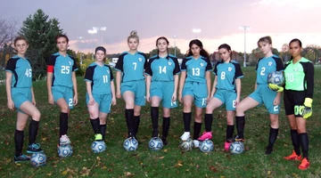 members of the cast dressed in soccer garb