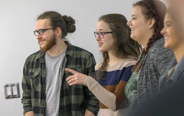 students engage in a classroom discussion