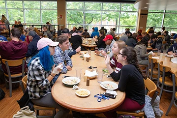 students eat lunch in Cranston Marche