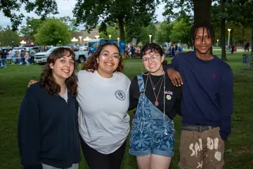 Students stop for a quick photo during activities night on campus