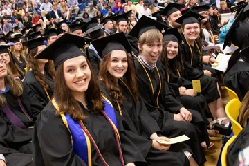 grads getting ready to cross the stage
