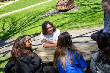 students enjoying a spring day on campus