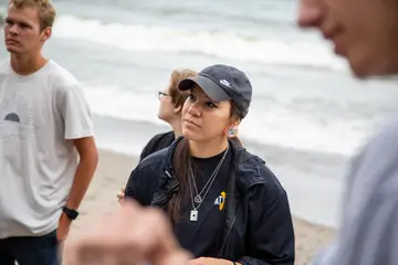 Fredonia student in a biology class conducting research on the shores of Lake Erie. 