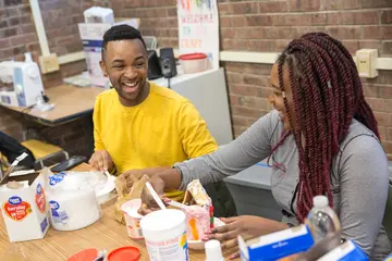 Fredonia students making gingerbread during a fall activity