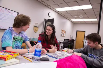 Fredonia students in the Honors Lounge work on a challenging project