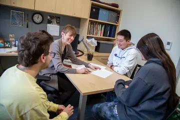 Fredonia students enjoy small class sizes, like this group meeting with their math professor