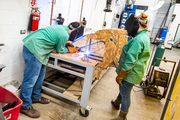 students working in the shop building a set