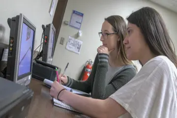 students watch a monitor in an observation room in the youngerman clinic