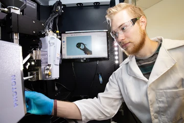 a student works in a lab in the Science Center