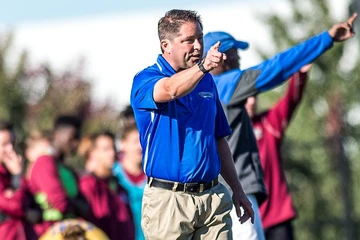 fredonia coach on sidelines of a soccer game