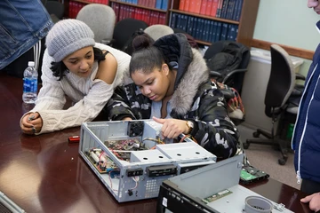 students rebuild a computer during a computer competition