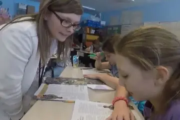 a fredonia student teaches children in a local classroom